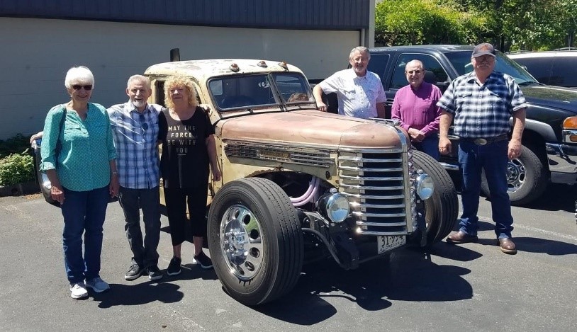 Dan Mincey (far right) pictured with previous retirees and his Diamond T  truck.